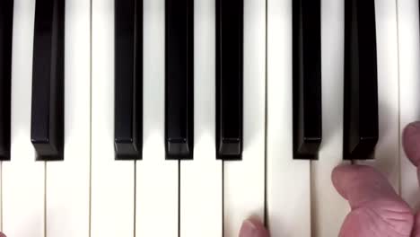 Slider-shot-of-hands-playing-a-piano