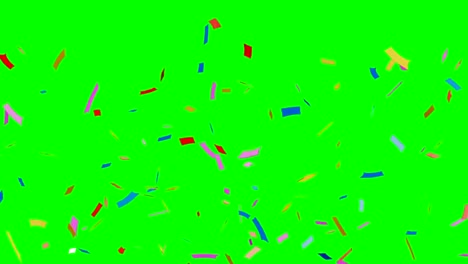 Multi-colored-confetti-falling-on-green.