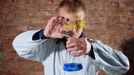 Crazy,-mad-scientist-conducting-a-chemical-experiment-in-laboratory,-slow-motion