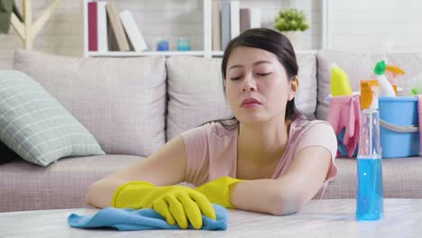 tired-woman-yawning-wiping-polishing-table