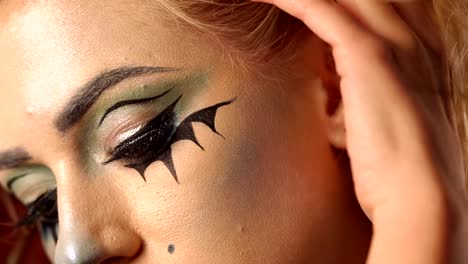 Portrait-of-young-beautiful-girl-with-make-up-skeleton-on-her-face.-Halloween.