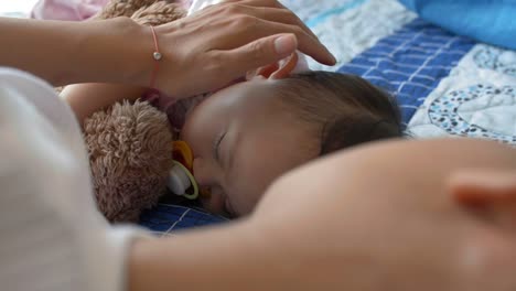 Woman-with-Sleeping-Kid