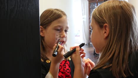 girl-putting-on-makeup-for-Halloween