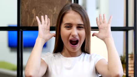 Portrait-of-Screaming-Upset-Young-Girl