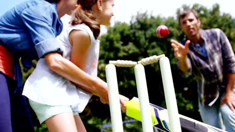 Happy-family-playing-cricket