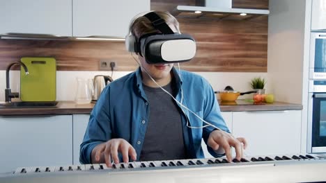 Young-man-learning-synthesizer-using-vr-lesson-tablet-application