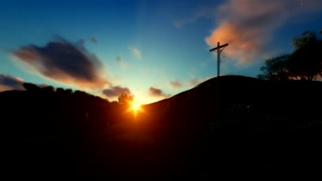 Woman-praying-at-Jesus-cross-against-beautiful-sunset,-panning