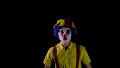 A-scary-clown-makes-fast-head-and-torso-movements.