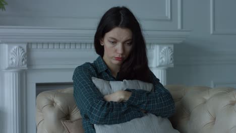 Depressed-lonely-young-woman-in-domestic-room