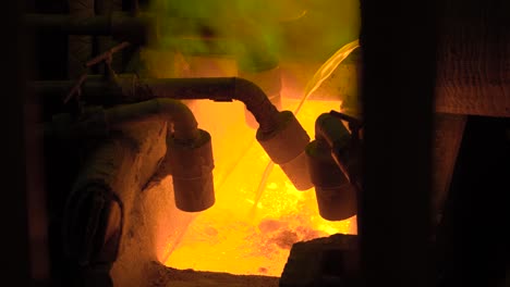 Hot-steel-pouring-at-steel-plant.-In-the-frame,-molten-metal-is-poured-through-special-channels,-for-the-further-rolling-with-a-special-machine.-Modern-metallurgical-industry