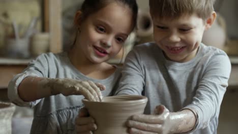 Little-Boy-and-Girl-Failing-in-Pottery-Class