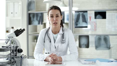 Female-Doctor-Talking-to-Camera-in-Clinic