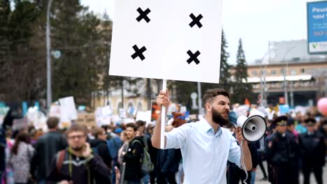 Man-at-political-meeting-with-banner-with-points-for-tracking-to-copy-space-text