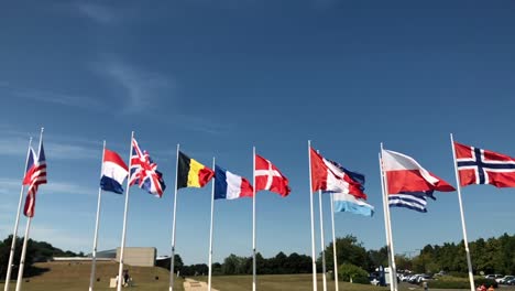 Flags-flying-united-in-WW2-memorial-in-Caen,-France