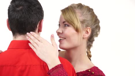 Couple.-Woman-whispering-to-man-ear-hugging-partner-4K