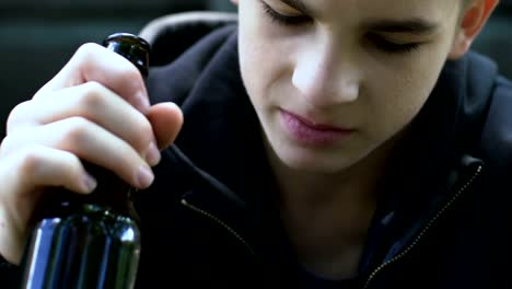 Teenager-drinking-beer,-forcing-himself,-alcohol-use-among-adolescent,-poverty