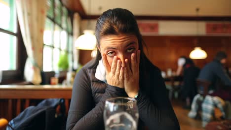 Real-life-woman-expression-of-dread-with-hands-on-face-looking-to-camera,-girl-worried-about-something