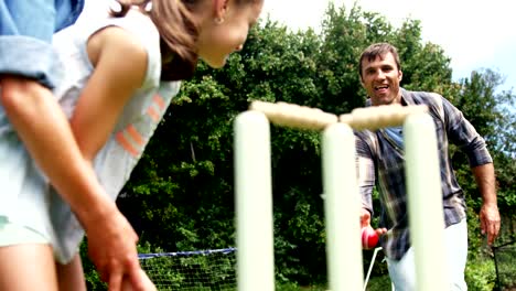 Happy-family-playing-cricket