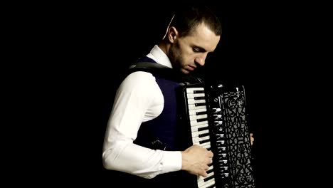 A-musician-in-a-white-shirt-plays-the-accordion.