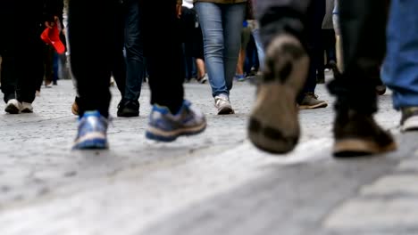 Legs-of-Crowd-People-Walking-on-the-Street