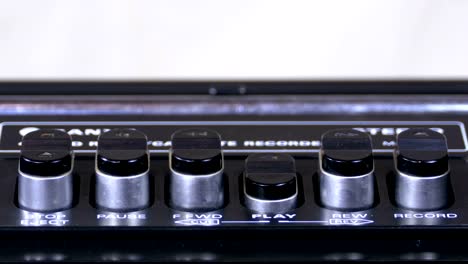 Pushing-Play-Button-on-a-Vintage-Tape-Recorder