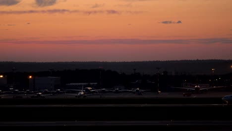 Planes-parking-and-airliner-driving-on-runway-in-Sheremetyevo-Airport,-Moscow