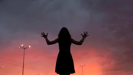 Witch-raising-hands-up-to-dark-night-sky,-mysterious-world,-spiritual-practice