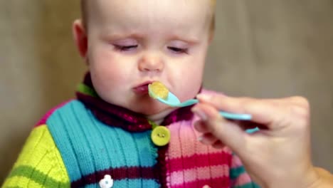 Baby-girl-does-not-want-to-eat-from-a-spoon