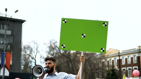 Man-with-poster-in-hands-at-demonstration.-Gay-and-lesbian-protest.-Lgbt-rally.