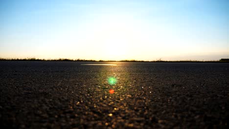 Cars-ride-on-the-asphalt-road-with-beautiful-landscape-at-background.-Vehicles-drive-along-highway-in-countryside.-View-on-the-country-road.-Close-up-Slow-motion