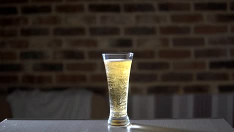 Glass-cup-filled-with-beer-on-the-table