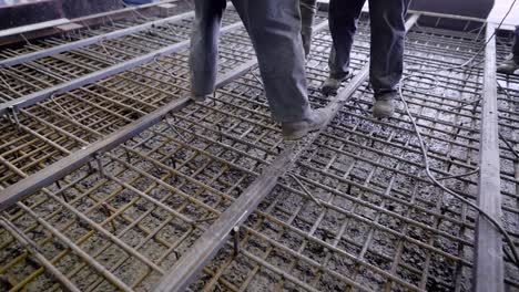 Workers-and-engineers-pour-foundation.-Tons-of-concrete-and-reinforcement-form-a-solid-monolithic-compound