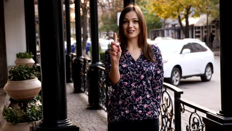 Young-woman-say-no-by-shaking-head-and-wagging-her-finger,-rejecting-gesture,-disagree-sign.-Emotional-face-expression.