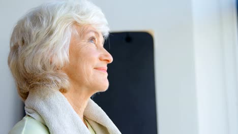 Thoughtful-senior-women-in-yoga-center-4k