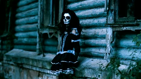 The-young-woman-with-make-up-for-Halloween-standing-in-front-of-wooden-wall.-4K