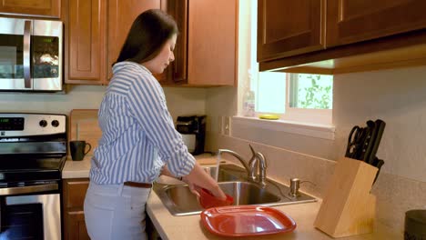 side-view-young-asian-woman-washing-dishes