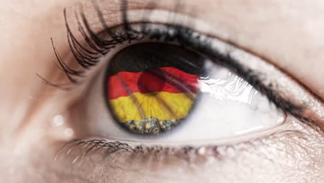 woman-green-eye-in-close-up-with-the-flag-of-Germany-in-iris-with-wind-motion.-video-concept