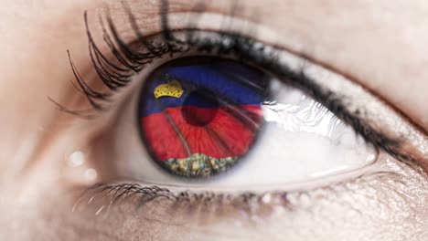 woman-green-eye-in-close-up-with-the-flag-of-Liechtenstein-in-iris-with-wind-motion.-video-concept