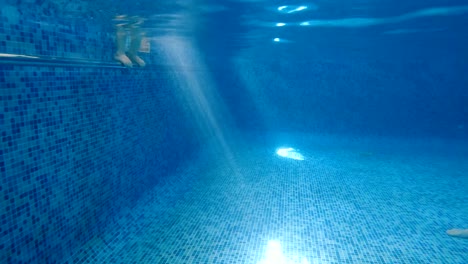 Swimming-pool.-Mom-teaches-a-child-to-swim-in-the-pool.