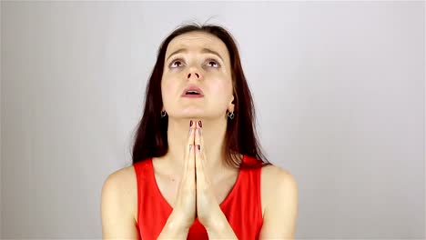 A-young-beautiful-woman-prays,-asking-God-for-help