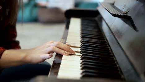 Young-girl-plays-piano