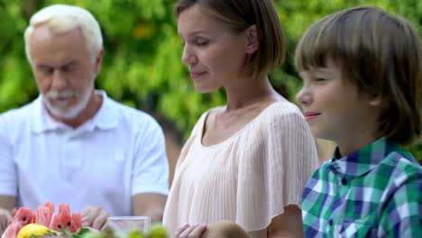 Happy-family-praying-together-before-dinner,-faith-in-God-and-spirituality