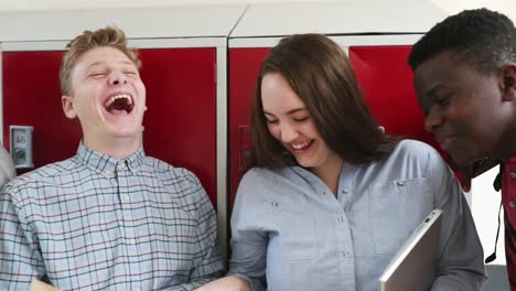 Handheld-Shot-Of-High-School-Students-Talking-With-Friends-In-Corridor