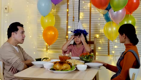 Little-girl-looking-mother-and-father-argue-with-each-other-at-home.