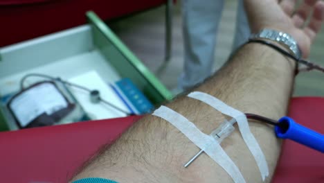 A-person-donating-blood-at-the-transfusion-department...