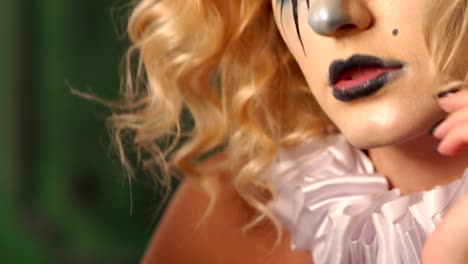 Close-up-portrait-of-an-excited-blonde-woman-with-make-up-in-halloween.