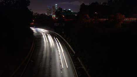 Leaving-downtown-Los-Angeles-city-skyline-traffic-commute-time-lapse