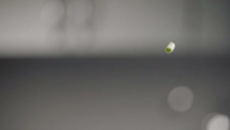 Falling-of-green-onion.-Slow-motion-240-fps