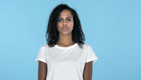 African-Girl-with-Frustration-and-Anger-Isolated-on-Blue-Background