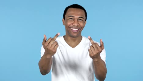 Happy-African-Man-Showing-Middle-Fingers-Isolated-on-Blue-Background